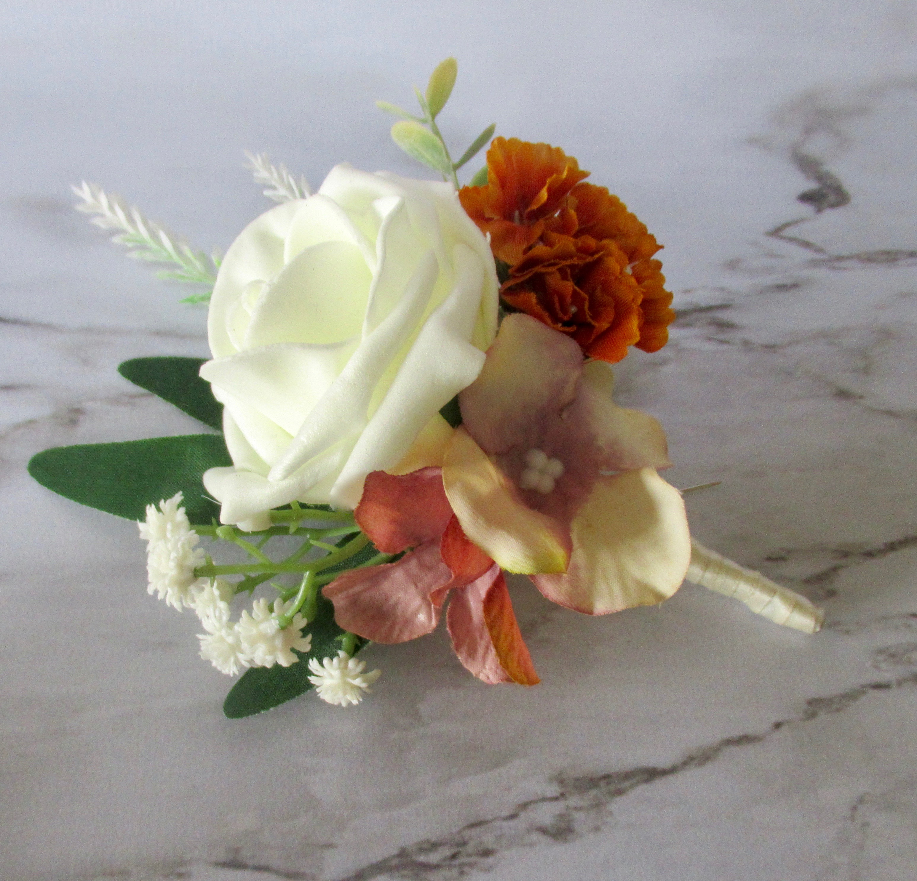 burnt orange and ivory buttonhole